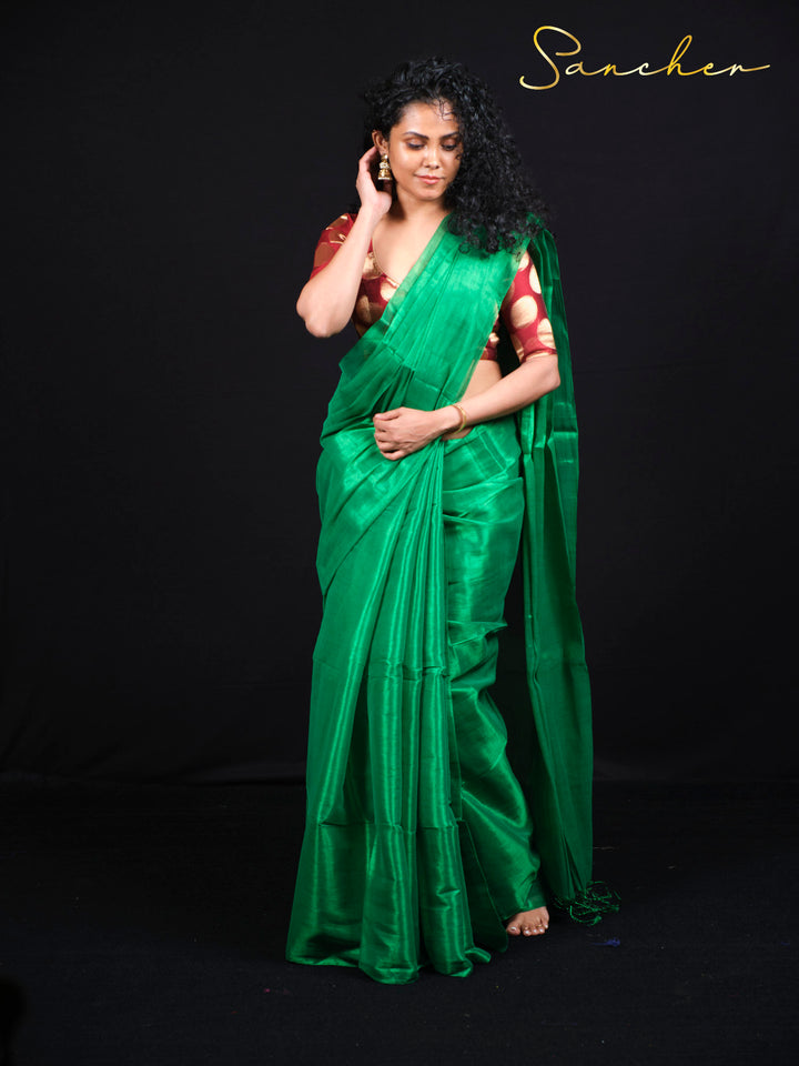 Side view of emerald green mul zari saree showing elegant draping and fall