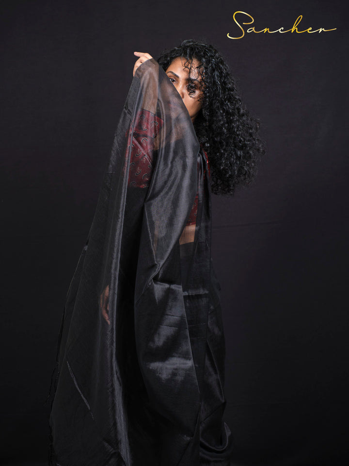 lose-up detail of black mul zari saree fabric showing traditional weave and texture