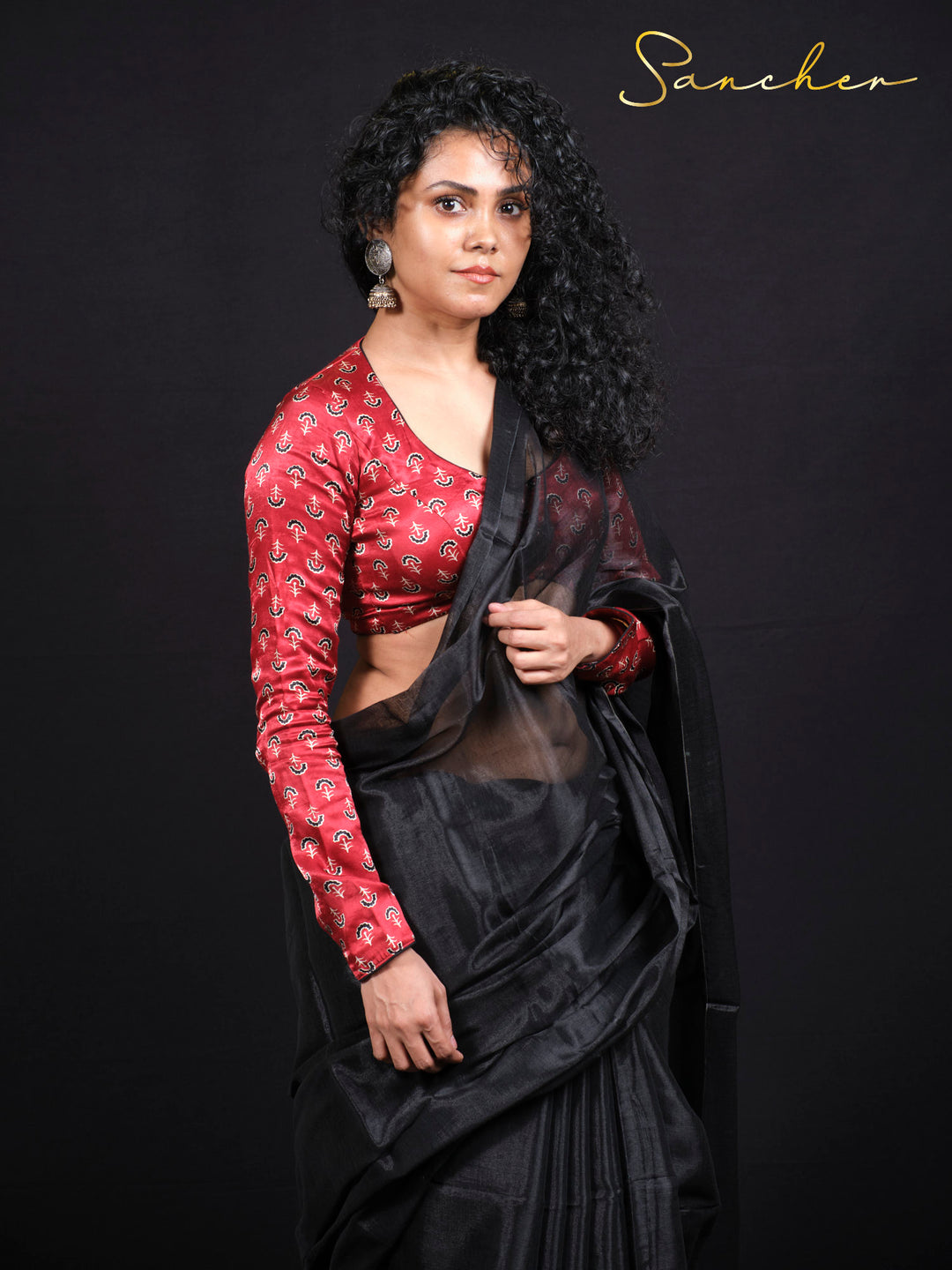 Side profile of woman wearing Black Panther mul zari saree perfect for festivals and special occasions