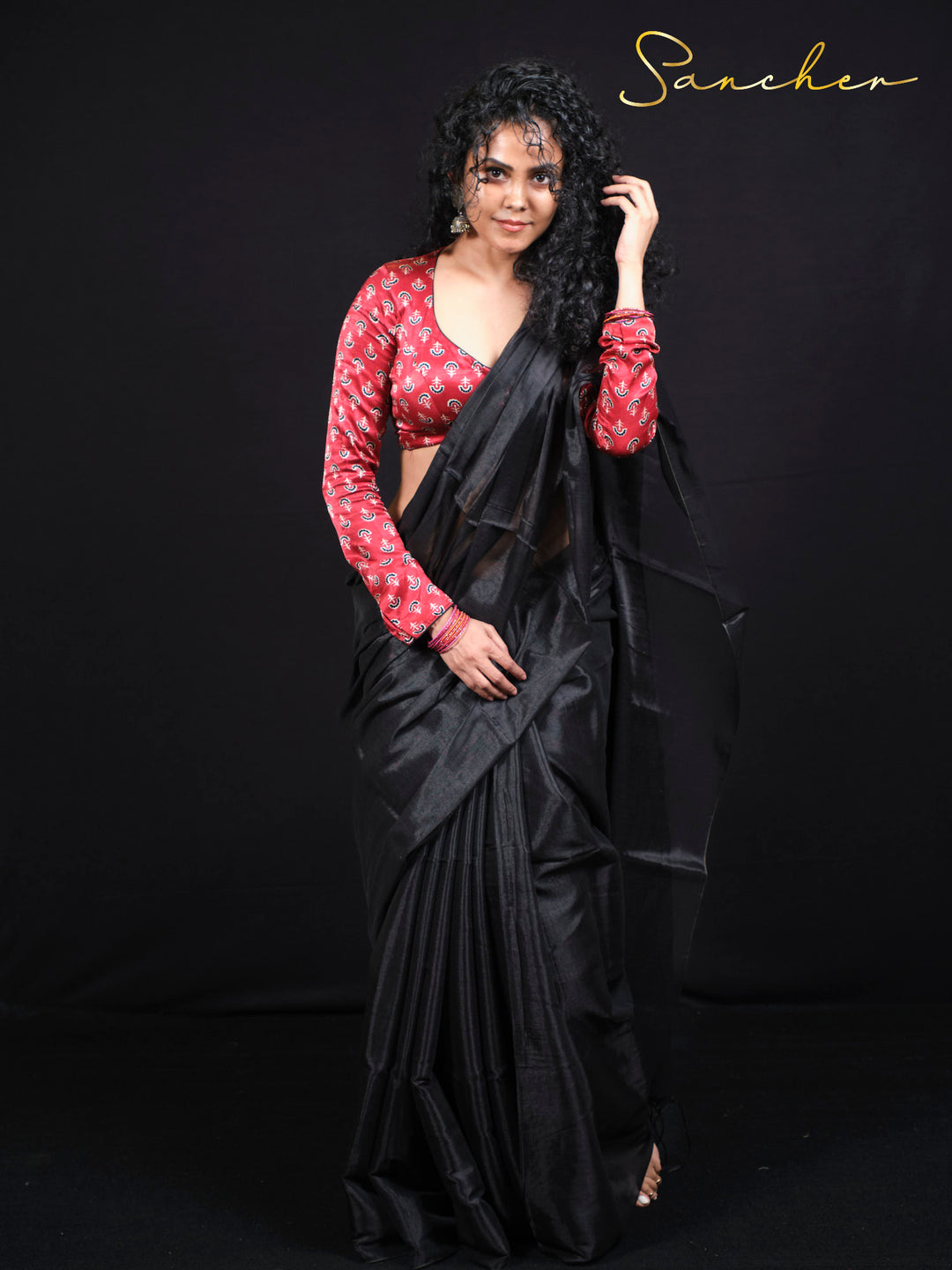 Full length view of designer black mul zari saree with traditional draping style for women.