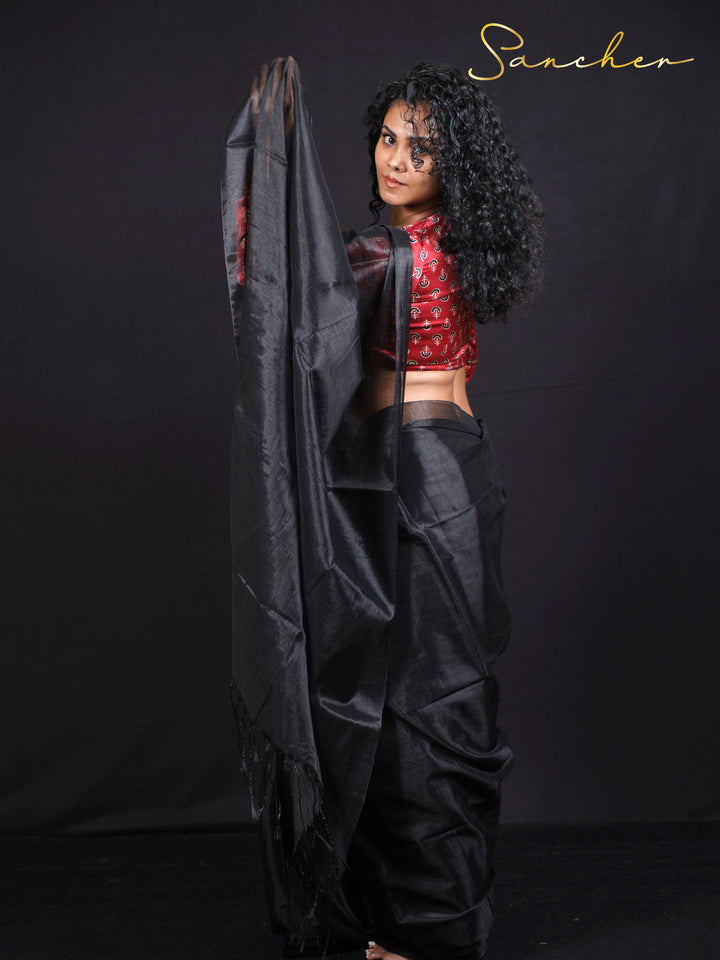 Side profile of woman wearing Black Panther mul zari saree perfect for festivals and special occasions