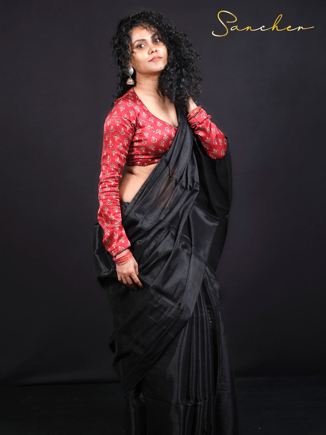 Front view of Black Panther mul zari cotton saree with contrasting red blouse for office and party wear