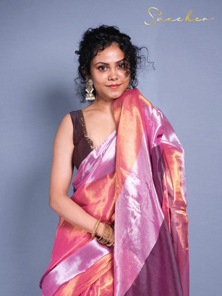Close up view of woman in elegant Mul Zari cotton saree with traditional earrings and gold bangles