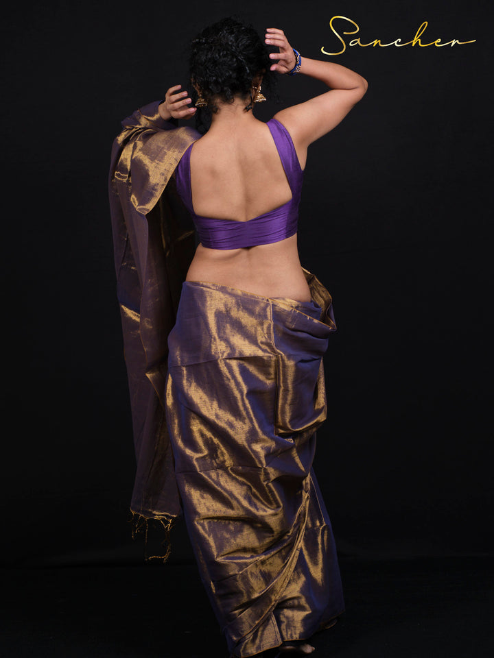 Traditional purple saree with golden zari pattern perfect for festivals