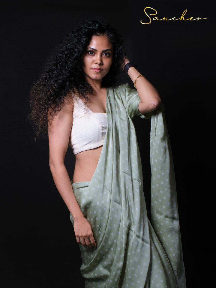 Close-up of woman in soft modal silk polka dot saree with curly hair