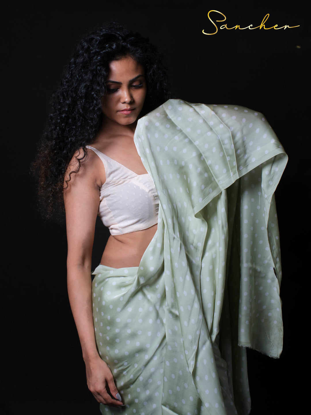 Modal silk saree with white crop top blouse showing contemporary styling
