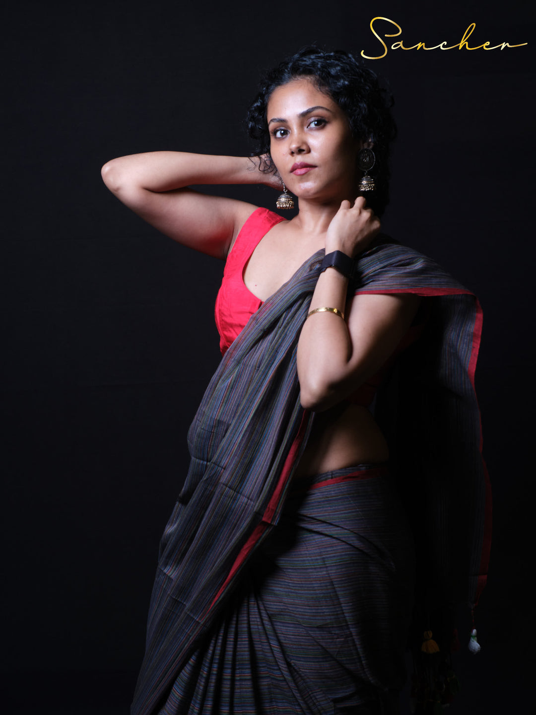 Coastal Charm charcoal gray mulmul cotton saree with rainbow pinstripes and red border front view