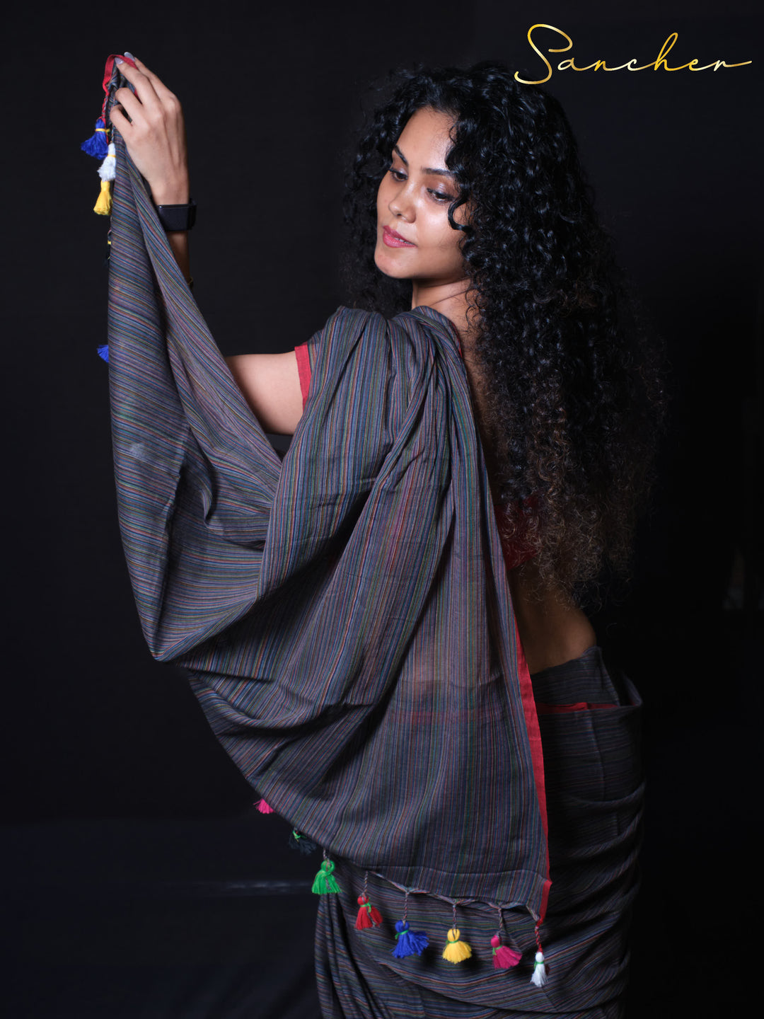 Coastal Charm handloom cotton saree close-up showing pinstripe pattern and colorful tassels