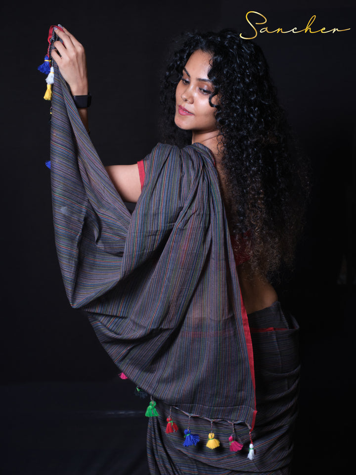 Coastal Charm handloom cotton saree close-up showing pinstripe pattern and colorful tassels