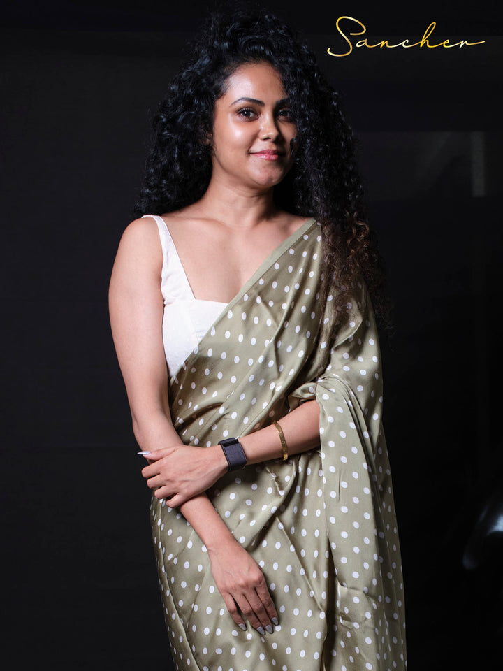 Portrait shot of woman in designer modal silk saree showing elegant neckline and professional styling