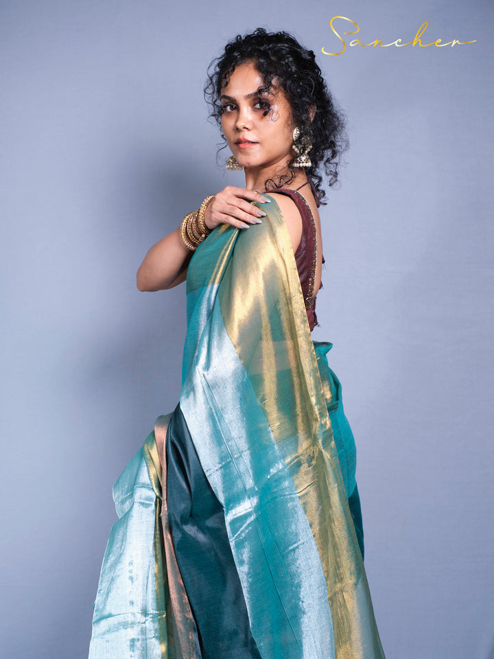 Side view of elegant mul zari saree showing shimmer fabric texture and traditional draping style