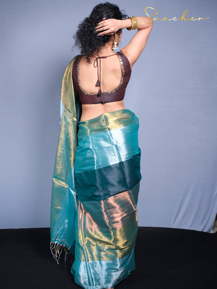 Rear view of designer mul zari saree highlighting traditional blouse design with embroidery