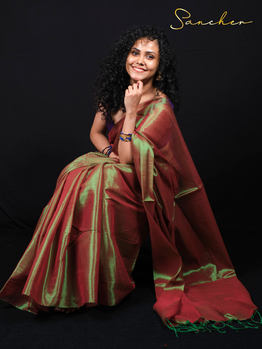 Designer mul zari saree for party featuring iridescent burgundy and golden-green pattern