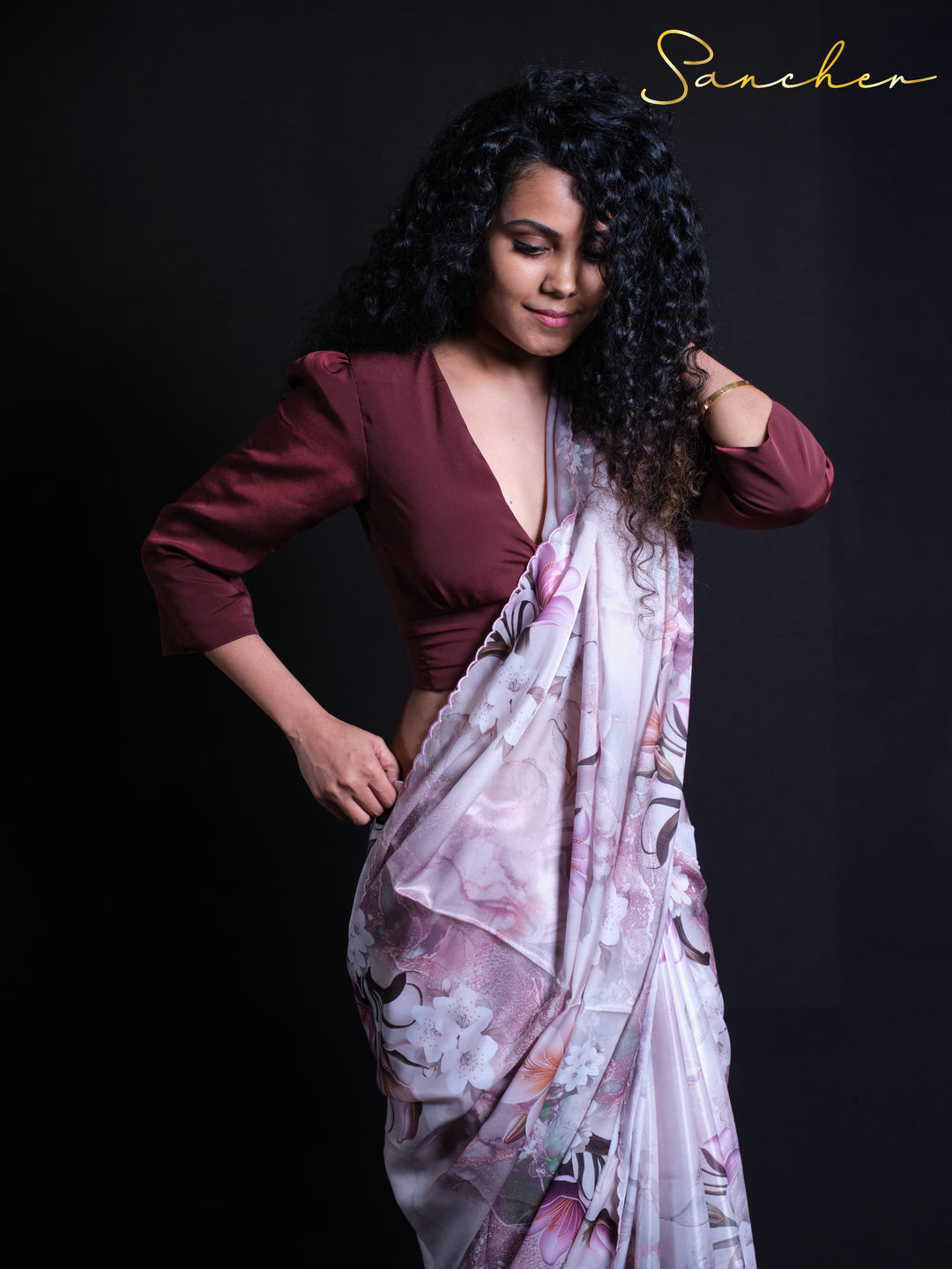 Model showcasing elegant drape of Late Tulip premium satin silk saree with stylish pose