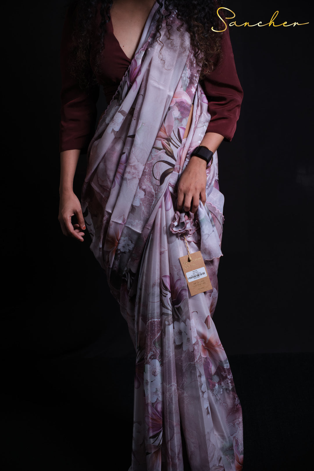 White and pink floral satin silk saree paired with burgundy three-quarter sleeve blouse