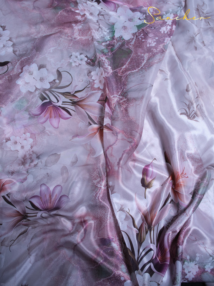 Close-up of premium satin silk fabric showing tulip and lily floral pattern details