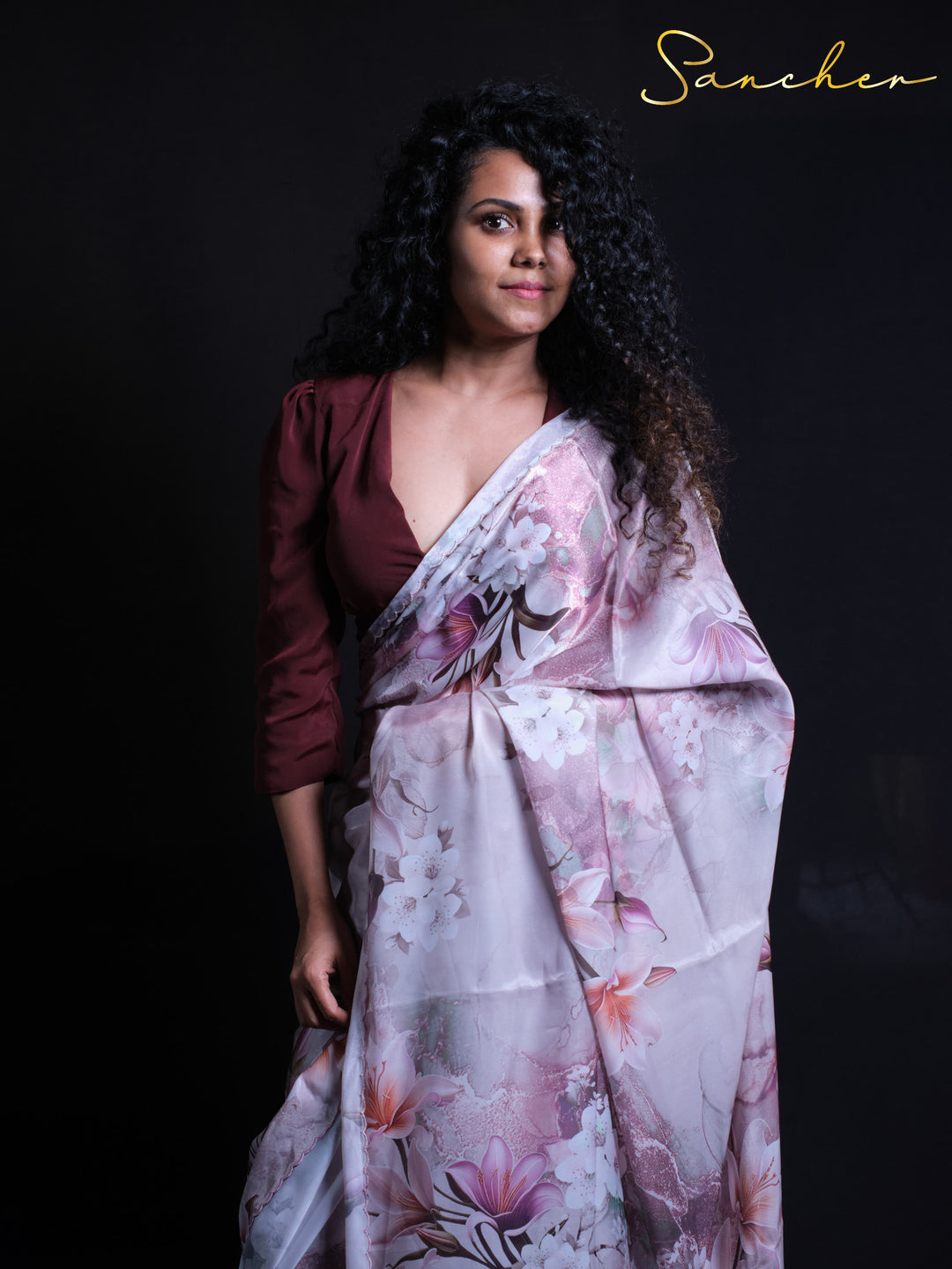 Close-up of premium satin silk fabric showing tulip and lily floral pattern details