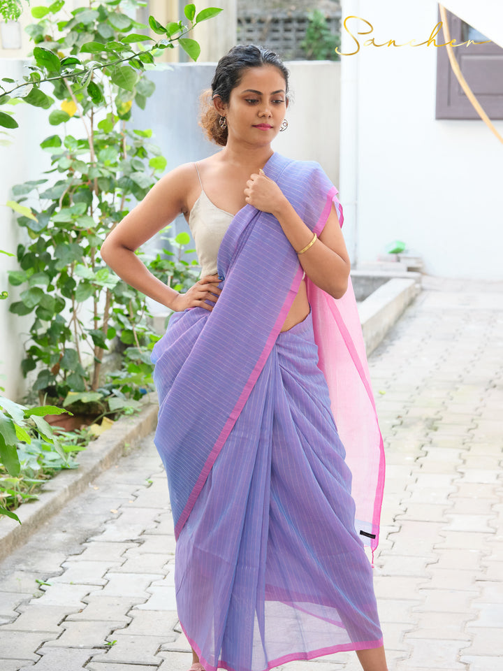 Full-length view of woman in lavender and pink mul cotton saree from saree boutique in Anna Nagar, ideal for professional office wear, demonstrating casual sarees for office available at best saree shops in Anna Nagar and online.
