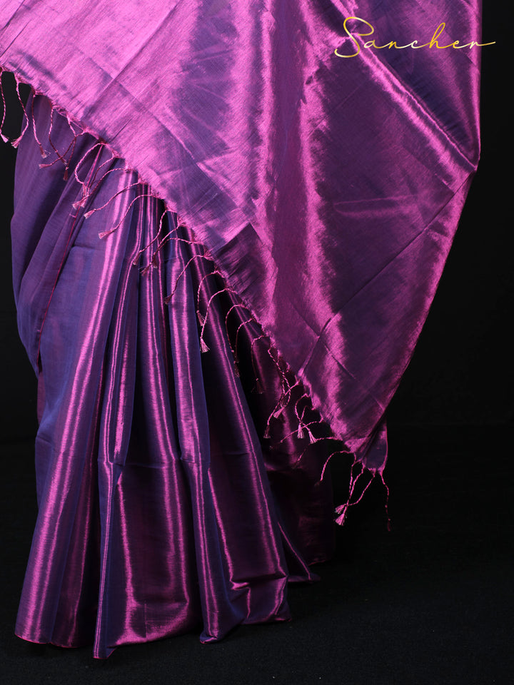 Close up detail of purple mul zari saree fabric showing silk texture and tasseled border