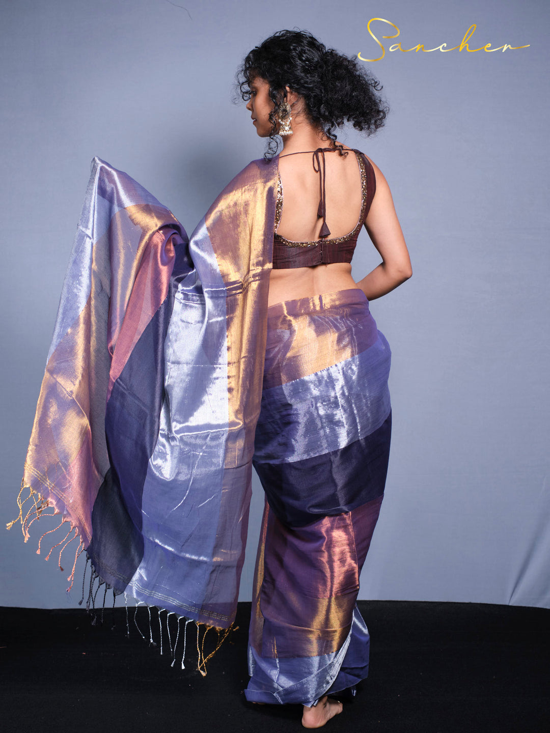 Back view of Midnight Sparkle Mul Zari saree showing blouse design and draping style