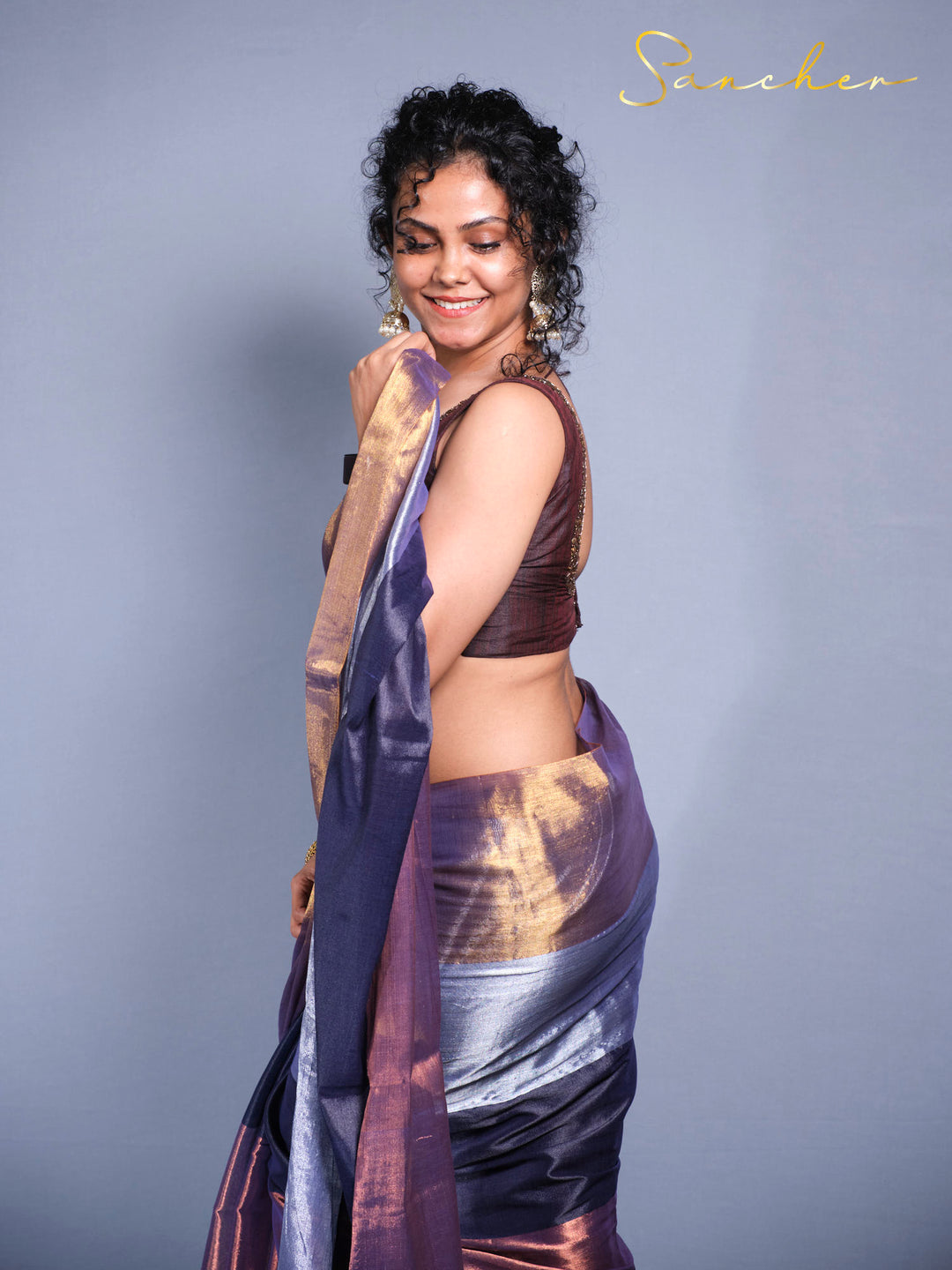 Side pose of showcasing Designer Mul Zari saree with iridescent fabric perfect for festivals