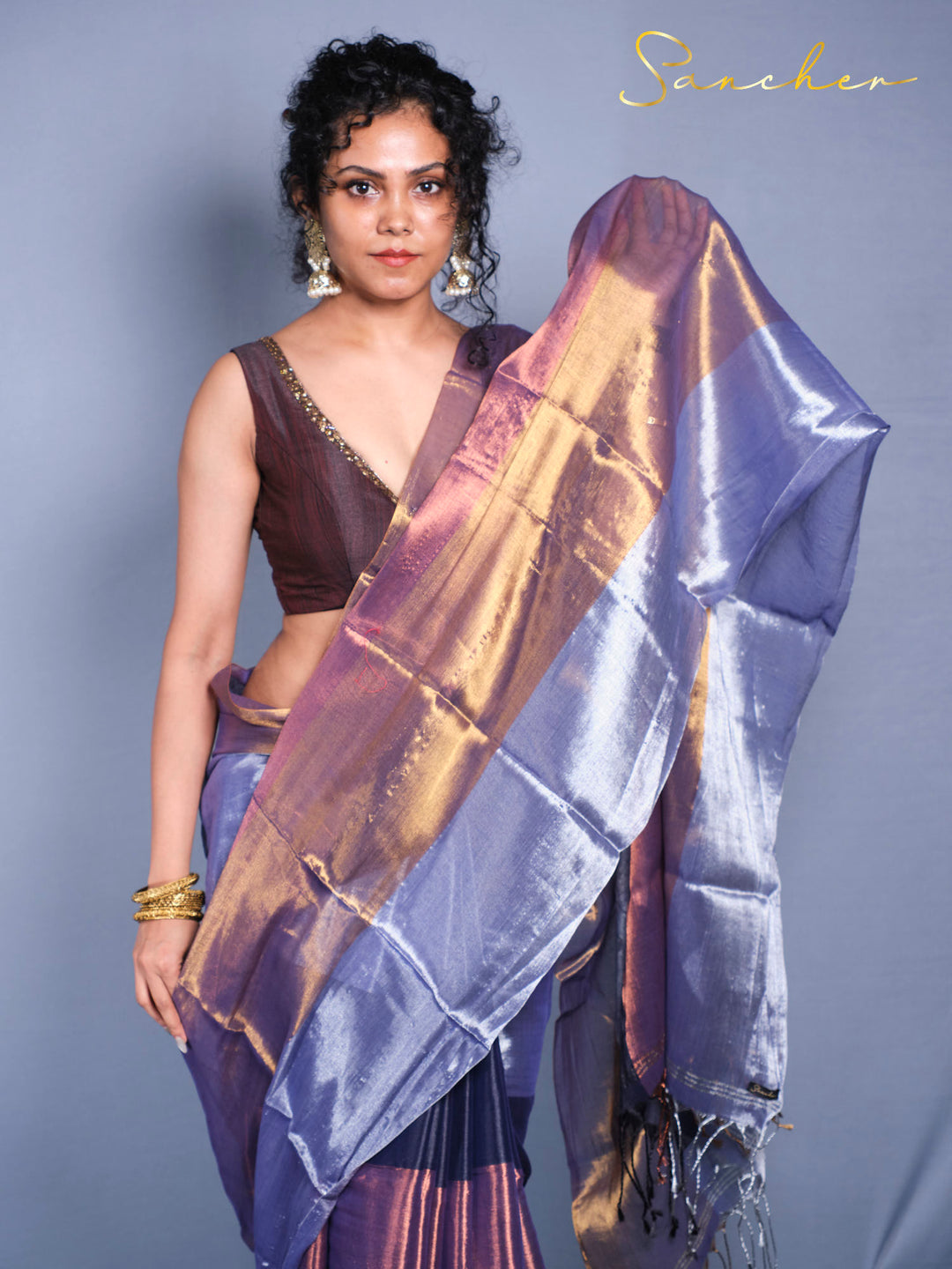Woman wearing Purple blue Mul Zari cotton saree for office and party wear front view