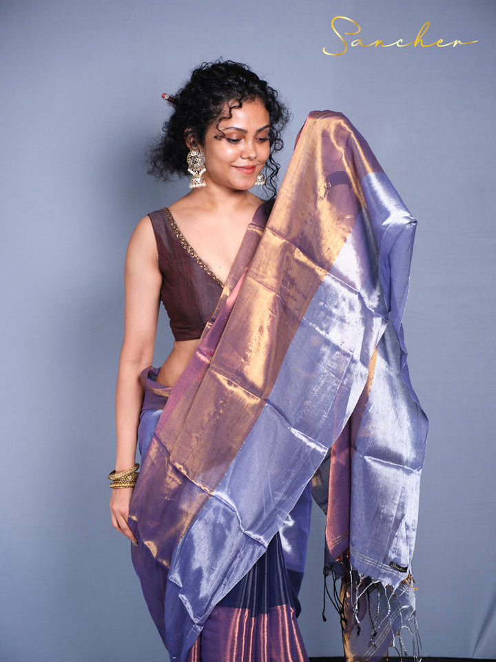 Woman wearing purple blue Mul Zari saree with golden shimmer front view