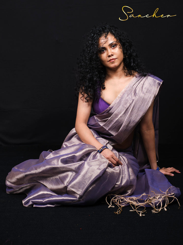 Designer purple mul zari saree with shimmery metallic finish and ethnic border