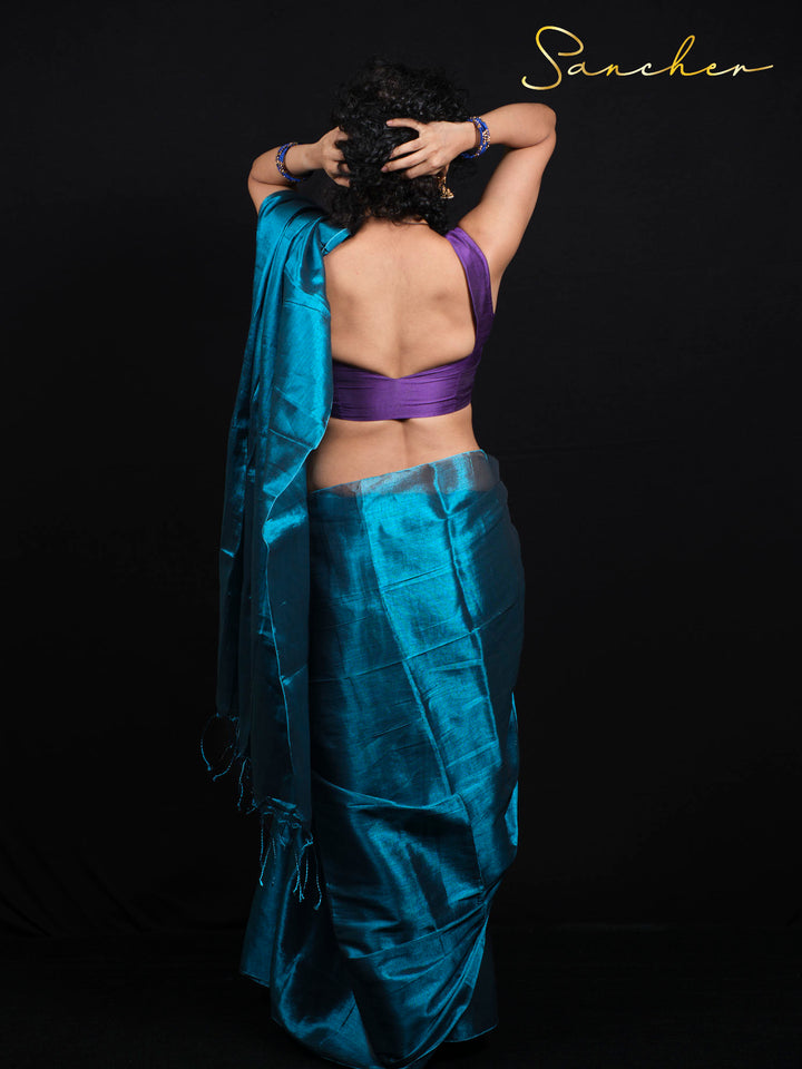 Back view of Mul Zari saree showing traditional draping technique with purple contrast blouse piece included