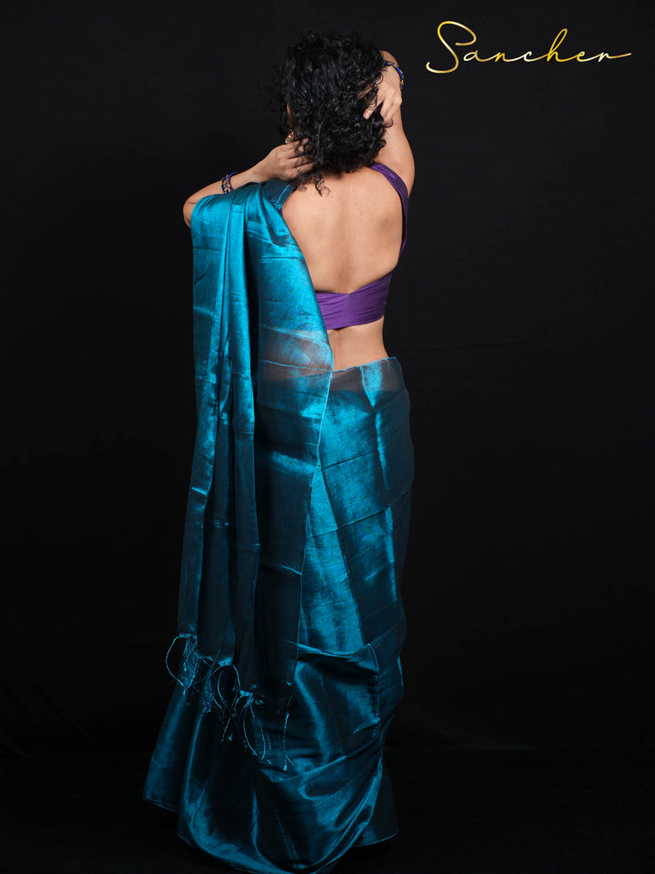 Back view of Mul Zari saree showing traditional draping technique with purple contrast blouse piece included