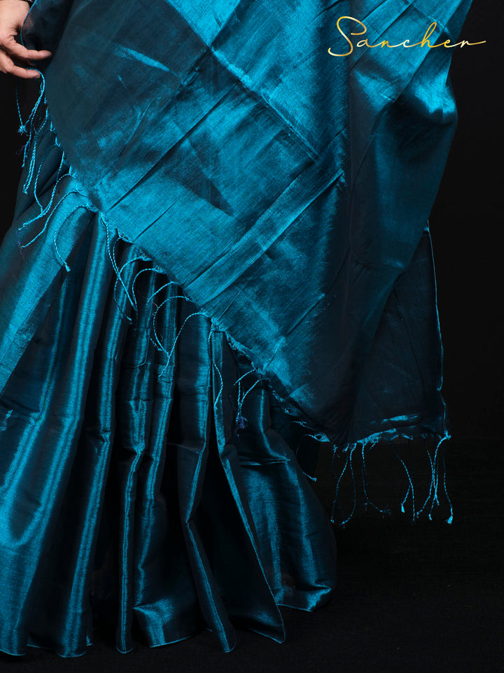 Close-up detail of Mul Zari saree fabric showing intricate weave pattern and silk texture quality