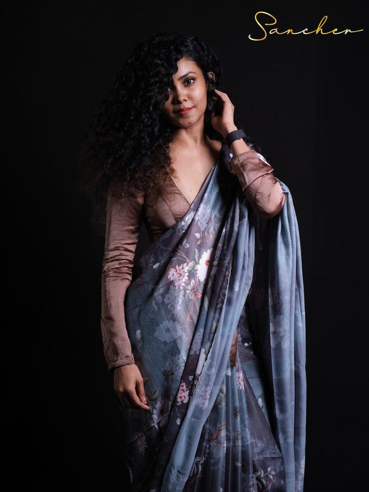 Woman wearing Night Flowers Premium Satin Silk Saree with dusty rose blouse