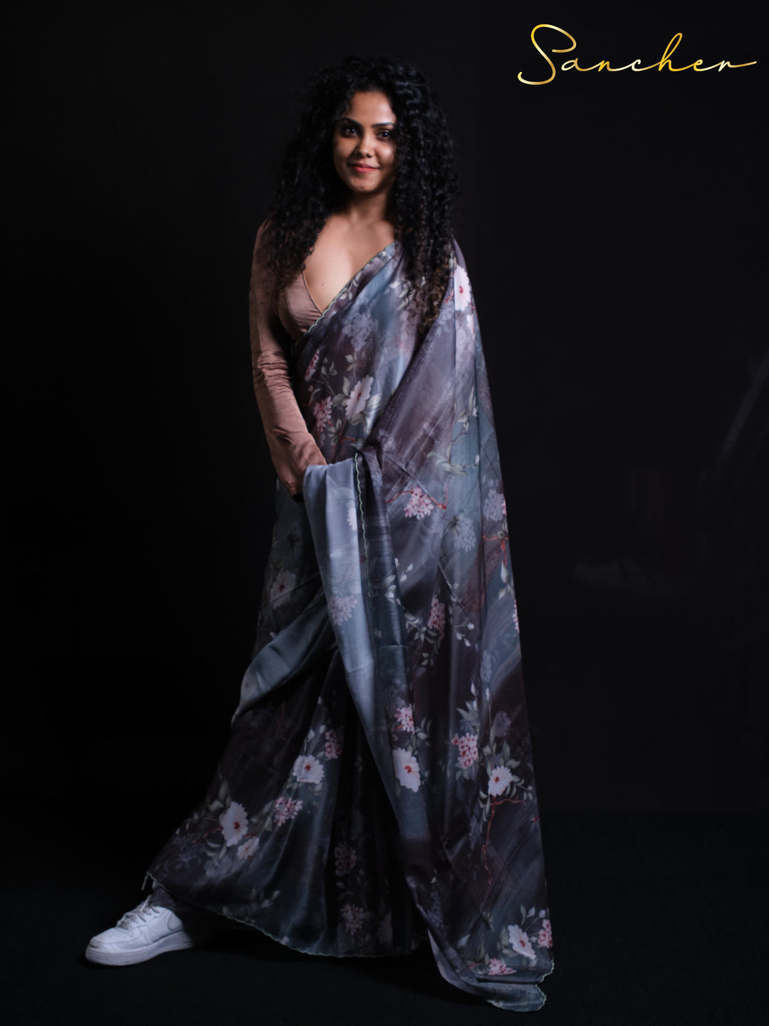 Contemporary styling of Night Flowers Premium Satin Silk Saree with white sneakers