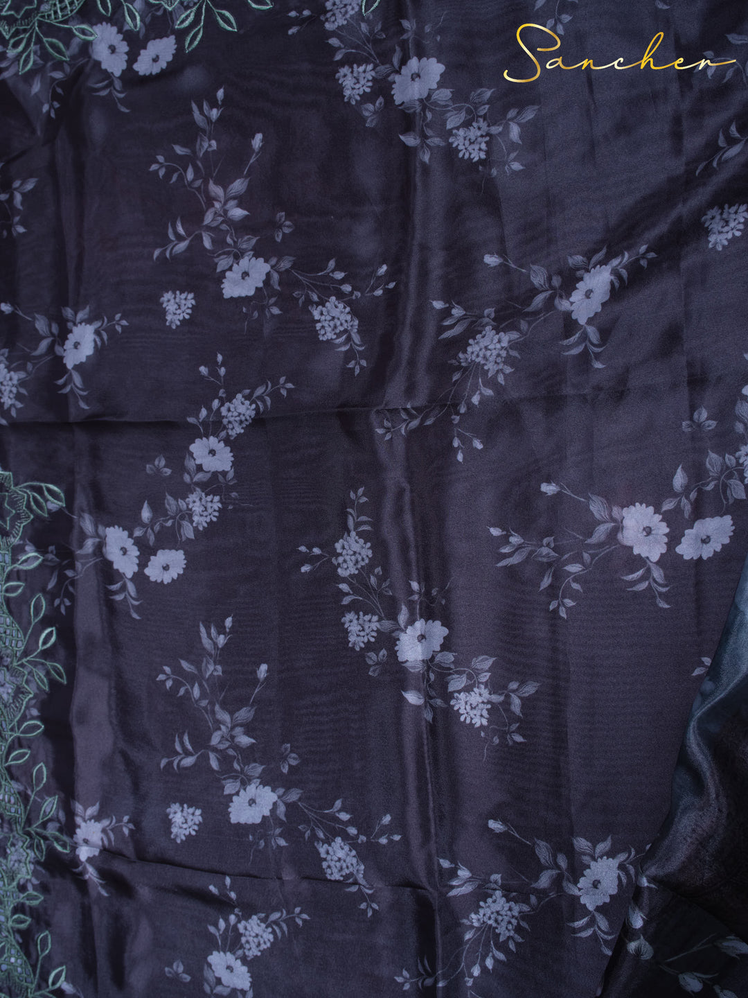 Detail of Night Flowers Satin Silk Saree fabric showing floral pattern texture