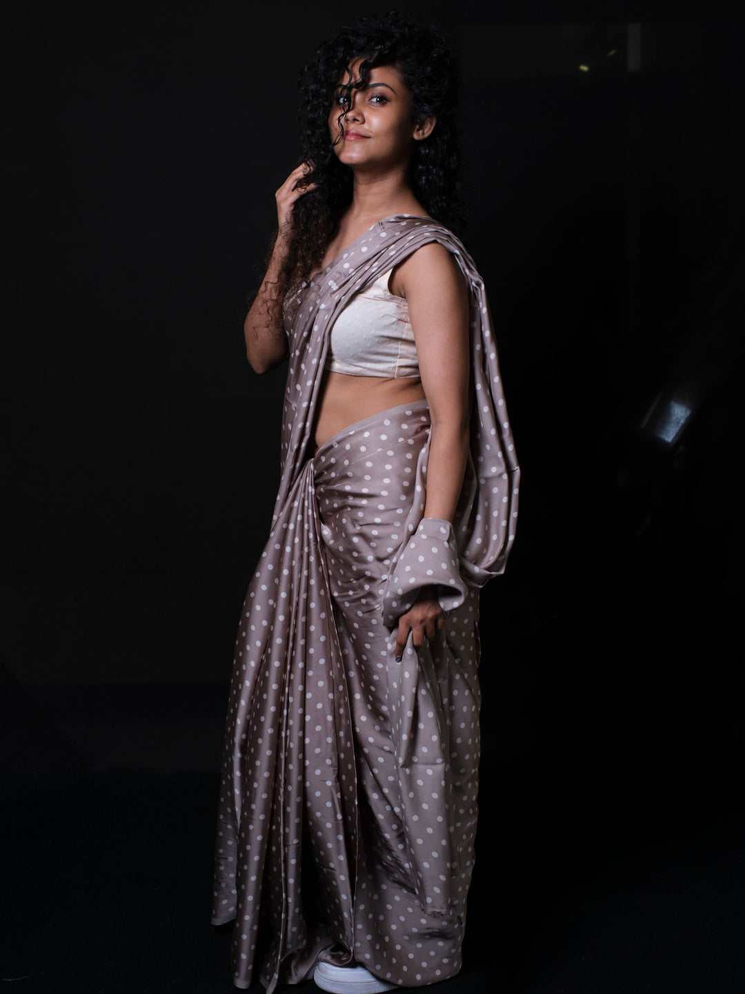 Side view of polka dot modal silk saree showing elegant draping and lightweight fabric flow