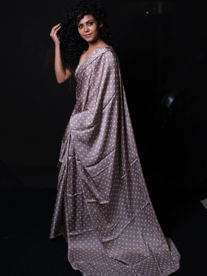 Full length view of ocher dark modal silk saree with white polka dots perfect for party wear