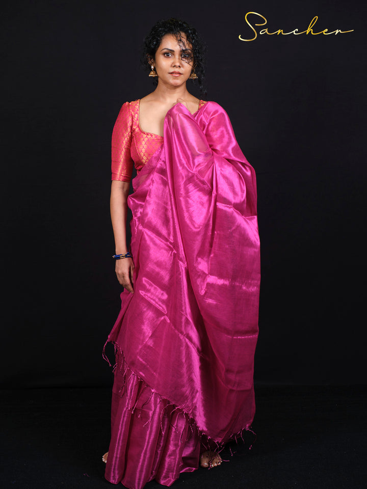 Full length view of Magenta Rose Radiance ethnic Mul Zari saree with decorative tassels and border design
