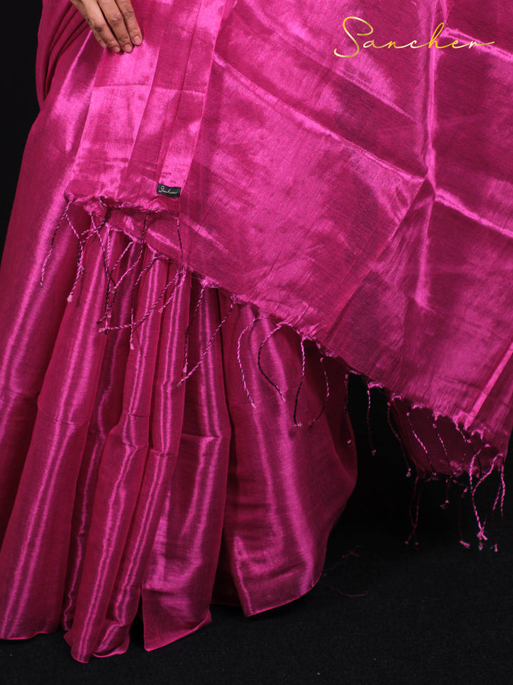 Close-up view of Rose Radiance saree's golden zari work and premium Mul silk fabric quality