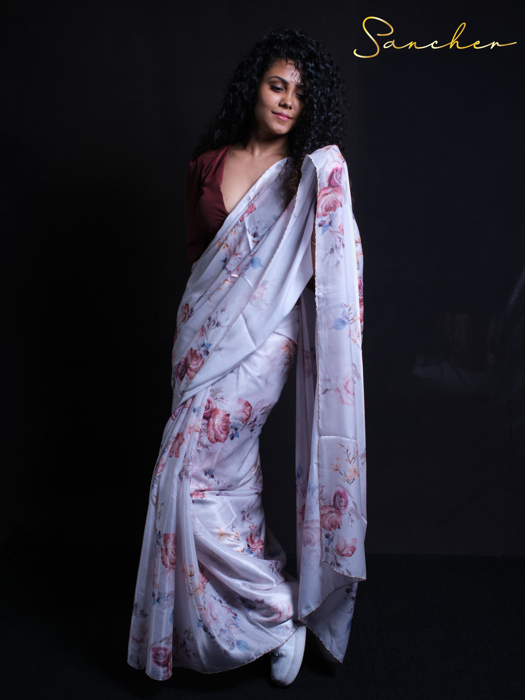 Standing pose showcasing Rose Petal premium silk saree with floral design