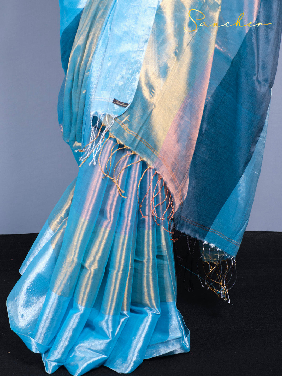 Traditional Indian saree with modern holographic fabric and classic burgundy blouse piece