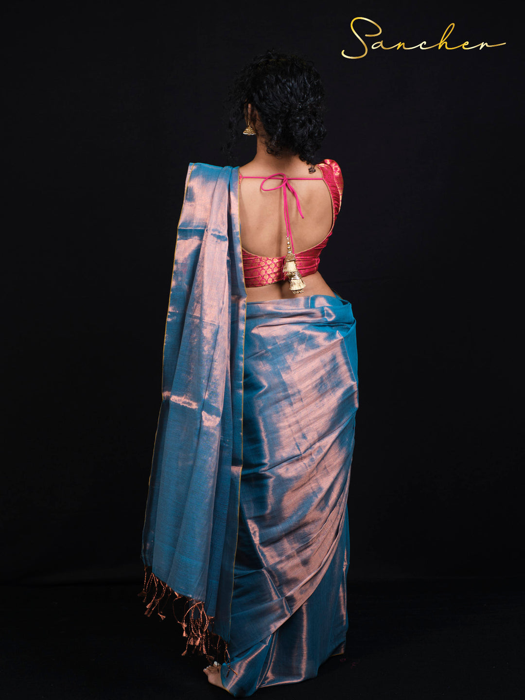 Back view of Sancher Sea Blue Mul Zari saree showing pink brocade blouse with tie-back design