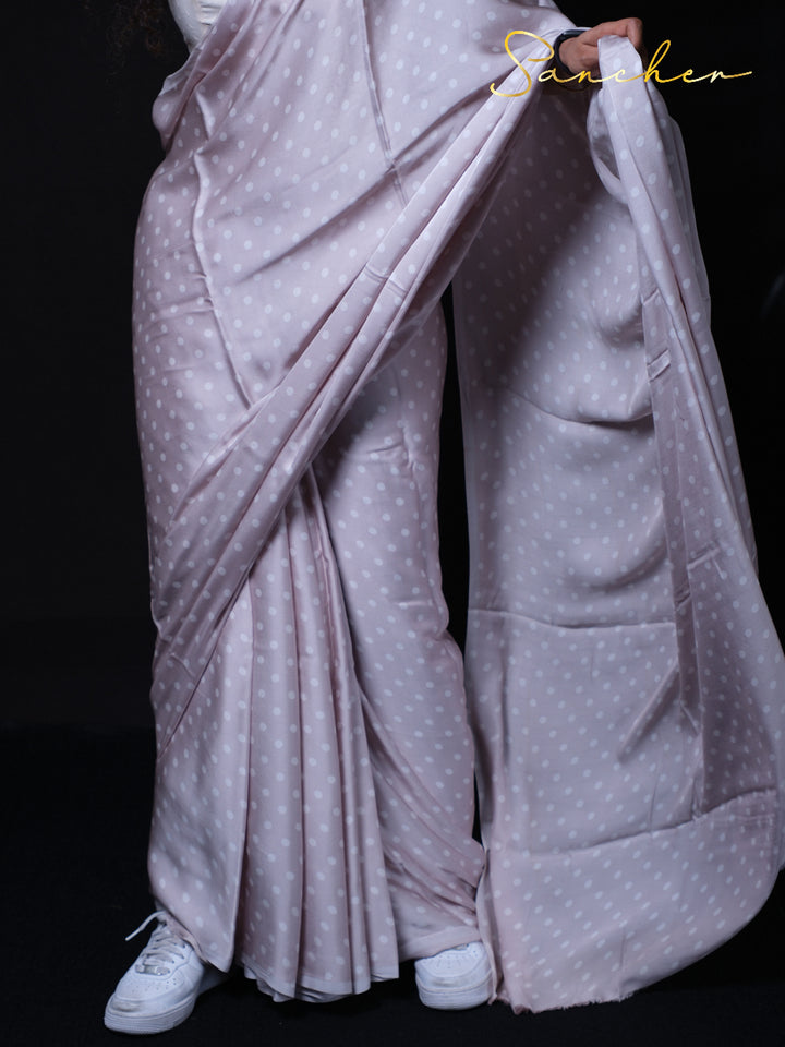 Detailed shot of modal silk saree pleats showing premium fabric quality and polka dot design