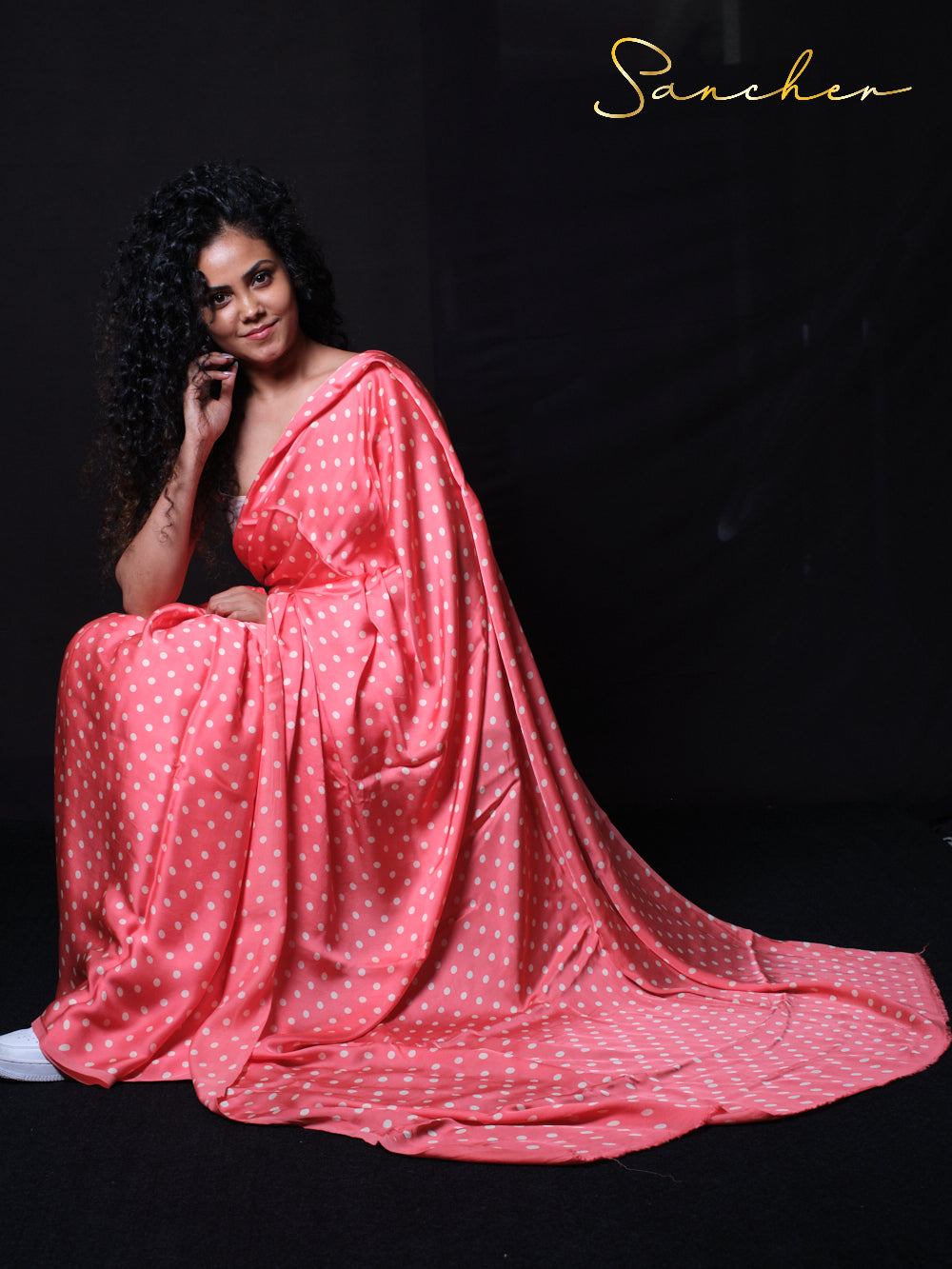 Beautiful model posing in Summer Heat modal silk saree with white polka dots showing traditional Indian wear styling