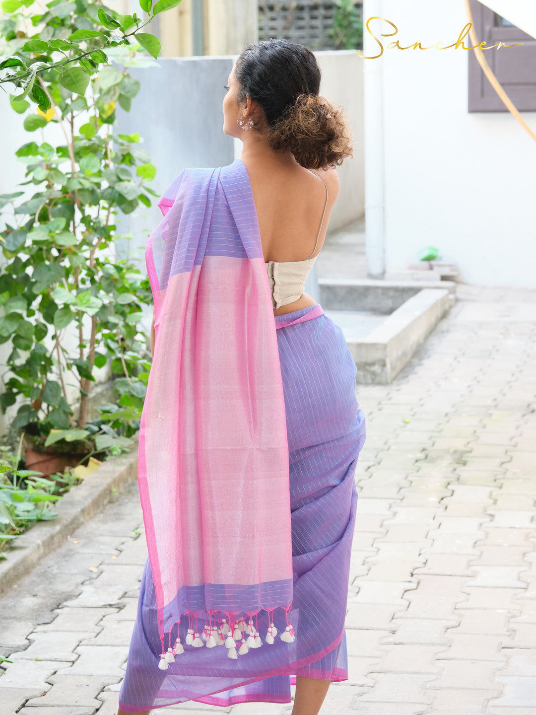 Back view of lavender and pink mul cotton saree from best saree shop in Anna Nagar, showing draping of professional workwear saree, available at saree boutique for casual office wear and online.