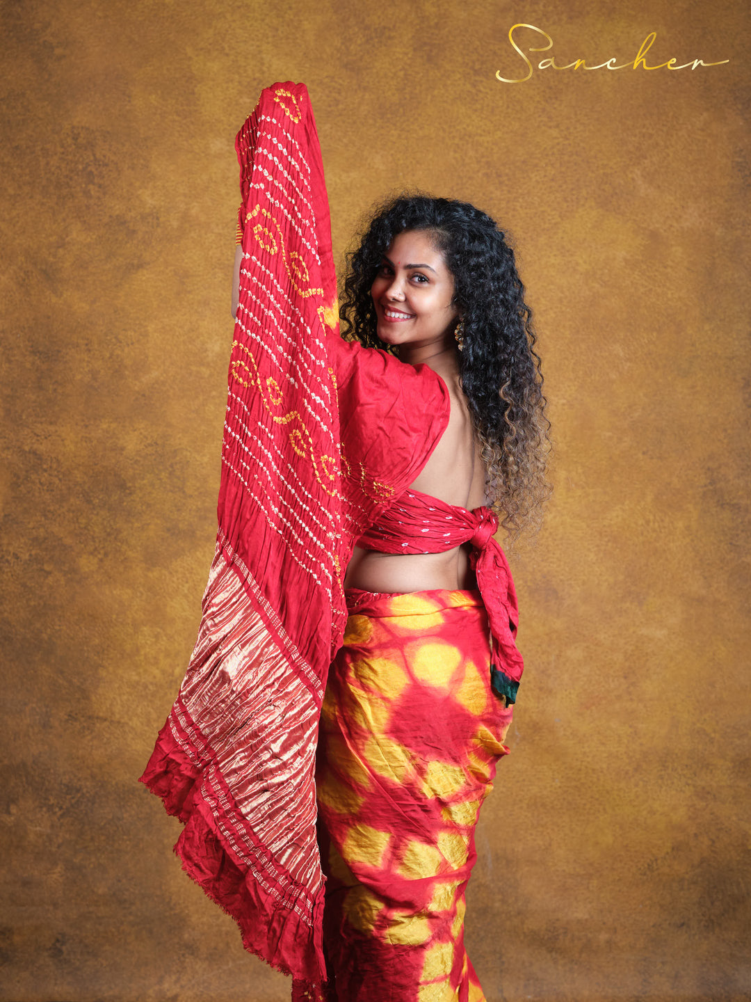 flame red bandhani saree