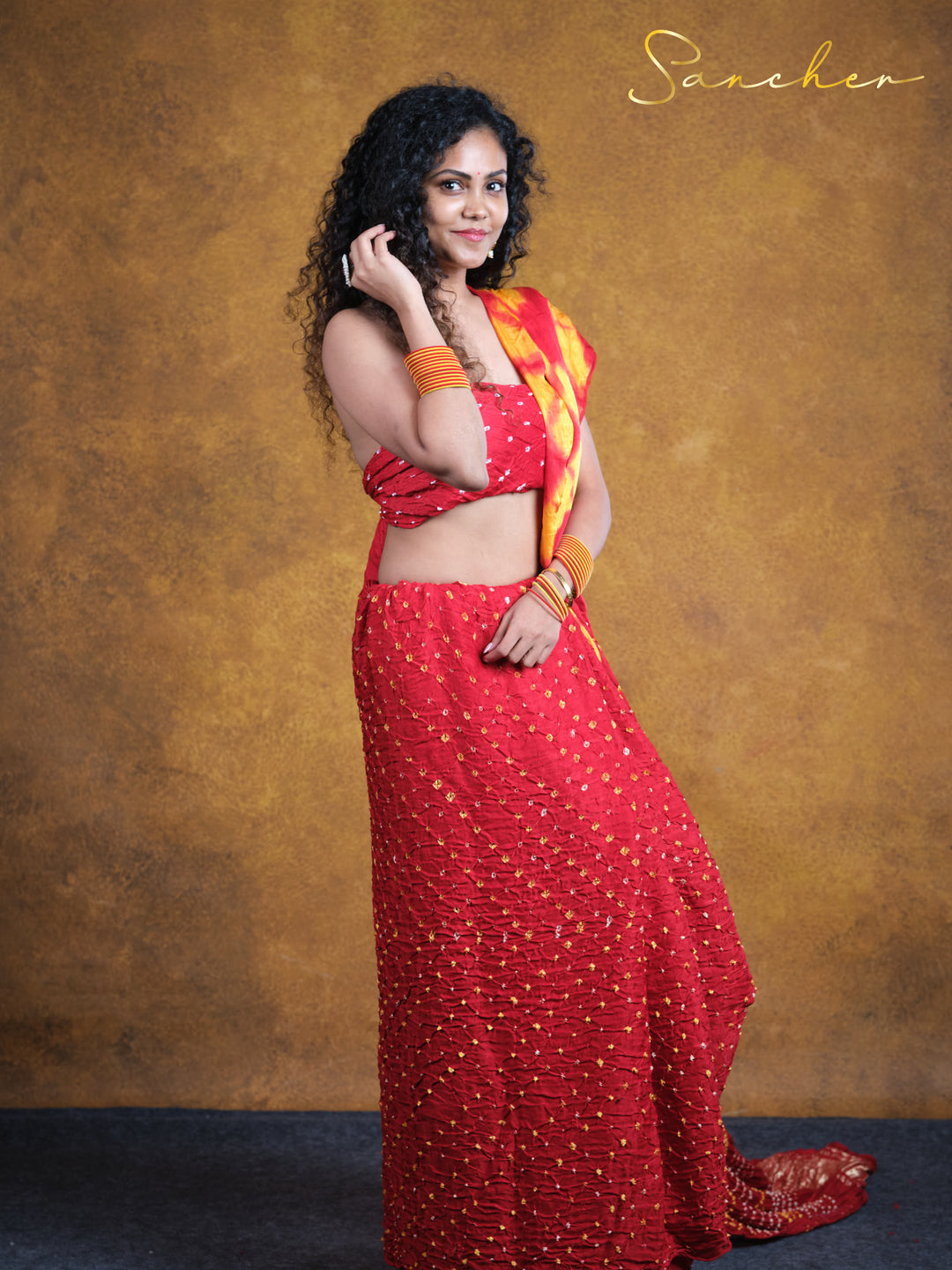 flame red bandhani saree