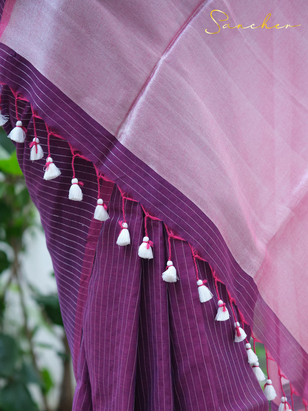 Close-up of a purple mul cotton saree with white tassels and pink border, highlighting intricate details suitable for professional attire. Keywords: Mul Cotton Sarees, Professional Office wear Sarees, Saree Boutique in Anna Nagar, Workwear sarees