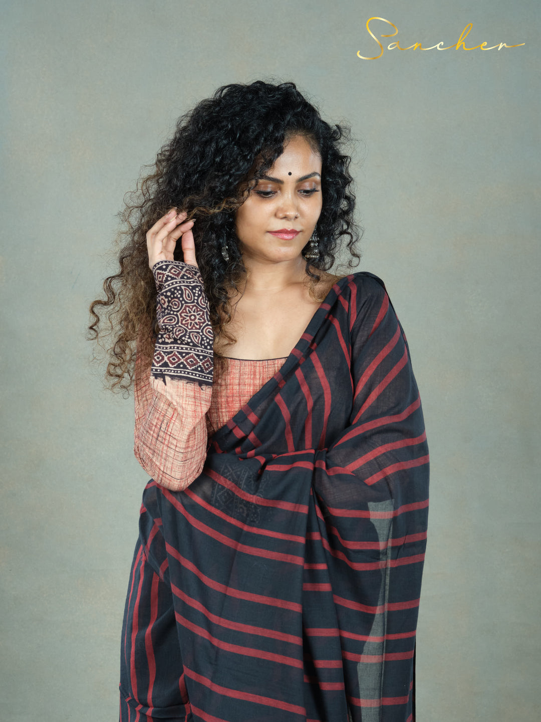 black an red stripe saree